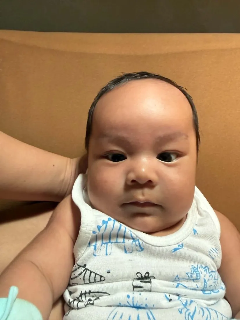 Baby Louis with a serious little face